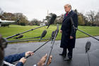 President Donald Trump speaks to members of the media before boarding Marine One on the South Lawn of the White House on Nov. 26. (AP Photo/Andrew Harnik)