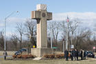 Visitors walk around the 40-foot Maryland Peace Cross dedicated to World War I soldiers on Wednesday, Feb. 13, 2019 in Bladensburg, Md. (AP Photo/Kevin Wolf)