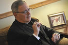 In this Nov. 22, 2009 file photo, Roman Catholic Bishop Thomas Tobin speaks to a reporter in Riverside, R.I. Tobin, Rhode Island's Roman Catholic bishop is facing backlash after tweeting Saturday, June 1, 2019 that Catholics should not support or attend LGBTQ Pride Month events. (AP Photo/Josh Reynolds, File)