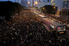 Protesters gather on a main road near the Legislative Council on June 16 as they continuing protest against the unpopular extradition bill in Hong Kong. (AP Photo/Kin Cheung)