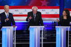 Democratic presidential candidate former vice president Joe Biden, left, Sen. Bernie Sanders, I-Vt., and Sen. Kamala Harris, D-Calif., all talk at the same time during the Democratic primary debate hosted by NBC News at the Adrienne Arsht Center for the Performing Arts, Thursday, June 27, 2019, in Miami. (AP Photo/Wilfredo Lee)