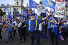 Anti-Brexit demonstrators march at Parliament Square, in London, on Tuesday, Sept. 3. (AP Photo/Alberto Pezzali)
