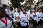 Women from different churches sing as they wait to see Pope Francis, ahead of his arrival at the Apostolic Nunciature in the capital Maputo, Mozambique, on Wednesday, Sept. 4, 2019. Pope Francis is opening a three-nation pilgrimage to southern Africa with a strategic visit to Mozambique, just weeks after the country's ruling party and armed opposition signed a new peace deal and weeks before national elections. (AP Photo/Ben Curtis)