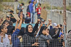 Refugees and migrants at a camp on the Greek island of Samos, on Oct. 18.  (AP Photo/Michael Svarnias)