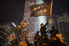 A protestor holds a flag that reads: "Liberate Hong Kong, Revolution of Our Times" at a rally in Hong Kong on Dec. 12. Protesters wrote hundreds of Christmas cards for detainees jailed during the city's pro-democracy movement. (AP Photo/Mark Schiefelbein)