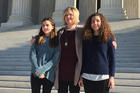 Kendra Espinoza, center, stands with her daughters Naomi and Sarah outside the U.S. Supreme Court on Jan. 22. Ms. Espinoza is the lead plaintiff in a case that could have major implications for the future of Catholic schools. (AP Photo/Jessica Gresko)