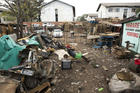 A man does exercises in a scrap yard, during lockdown due to the coronavirus, in Harare, Zimbabwe, Wednesday, April 8, 2020. (AP Photo/Tsvangirayi Mukwazhi)