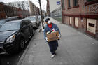 Francisco Ramírez delivers grocery donations in a neighborhood with a large immigrant population in the Bronx, New York, on April 18. (AP Photo/John Minchillo)