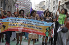 Activists march holding a banner that reads in Portuguese “Black women against racism, genocide and femicide. Our lives matter,” during a demonstration to mark International Women’s Day, in Sao Paulo, Brazil, on March 8, 2017. (AP Photo/Andre Penner)