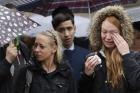 Londoners participate in a moment of silence on Tuesday morning to remember terrorist attack victims in the London Bridge area. (AP Photo/Matt Dunham)