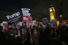 Demonstrators on Feb. 20, 2017, rally in Parliament Square against a planned state visit by U.S. President Donald Trump. (AP Photo/Tim Ireland)