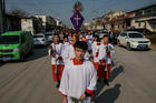 Altar servers lead a Palm Sunday procession March 25 in Youtong, in China's Hebei province. (CNS photo/Damir Sagolj, Reuters)