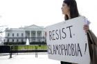 A peace activist holds a sign saying "Resist Islamophobia!" during a prayer service in early March outside the White House in Washington. (CNS photo/Tyler Orsburn)