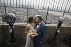 Newlyweds are seen on top the Empire State Building in New York City, 2015 (CNS photo/John Taggart, EPA).