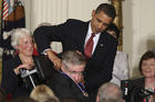 U.S. President Barack Obama presents the Medal of Freedom to Stephen Hawking during a ceremony at the White House in Washington Aug. 12, 2009 (CNS photo/Paul Haring).