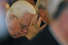 Boston Cardinal Bernard F. Law bows his head as a victim of clergy sexual abuse begins to address the U.S. bishops in 2002 in Dallas (CNS photo by Bob Roller).