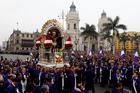 Men carry a replica of Peru's most revered religious icon, the "Lord of Miracles," during an Oct. 18, 2017 procession in Lima. Each year thousands of Catholics gather to commemorate the image's survival in a 17th-century earthquake that destroyed Lima. (CNS photo/Mariana Bazo, Reuters)