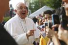 Pope Francis greets children outside Our Lady Queen of Angels School in the East Harlem area of New York Sept. 25, 2015 (CNS photo/Eric Thayer).