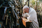 Pope John Paul II prays in 1993 at the Hill of Crosses in Siauliai, Lithuania. Pope Francis will make the same three-nation visit, stopping at a number of the same places as his saint-predecessor. (CNS photo/Arturo Mari, L'Osservatore Romano) 