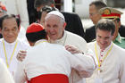 Pope Francis greets Cardinal Charles Bo of Yangon as he arrives at Yangon International Airport in Yangon, Myanmar, Nov. 27 (CNS photo/Paul Haring).