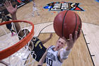 Michigan Wolverines guard Charles Matthews tries to defend a shot from Villanova Wildcats guard Donte DiVincenzo in the NCAA men's basketball championship April 2 in San Antonio. Villanova defeated Michigan, 79-62, winning its second championship in three years. (CNS photo/ Robert Deutsch, USA TODAY Sports via Reuters)