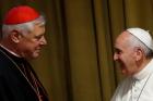 Cardinal Gerhard Müller greeting Pope Francis during the 2014 synod on the family. (CNS photo/Paul Haring)