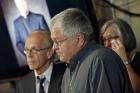 Ron Vasek, center, addresses a news conference along with his wife Patty, right, and attorney Jeff Anderson, left, on May 9, 2017 in St. Paul, Minn. Anderson announced a lawsuit against Bishop Michael Hoeppner of Crookston, Minn., accusing the bishop and diocese of concealing a report of abuse and threatening retaliation against Vasek if he went public. (AP Photo/Jim Mone)