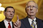 Senate Majority Leader Mitch McConnell of Ky., right, accompanied by Sen. John Barrasso, R-Wyo., meets with reporters on Capitol Hill in Washington, Tuesday, May 23, 2017, following after a Republican policy luncheon. (AP Photo/Jacquelyn Martin)