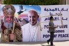 A billboard with a picture of Egyptian Coptic Pope Tawadros II, left, welcomes Pope Francis, at St. Mark's Cathedral in Cairo, Egypt, on Thursday, April 27, 2017.  (AP Photo/Amr Nabil)