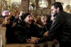 Women cry during the funeral for those killed in a Palm Sunday church attack in Alexandria Egypt, at the Mar Amina church, on Monday, April 10, 2017. (AP Photo/Samer Abdallah)