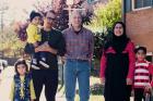 Rich McKinless with Rahim and Rayhanna Ibrahimi, and their three children, Layma, Hamza and Hasib