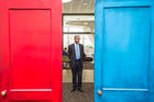 Housing and Urban Development Secretary Ben Carson inspects the federal department’s Fair Housing Door Exhibit marking the 50th anniversary of the Fair Housing Act. (U.S. Dept. of Housing and Urban Development, via Wikimedia Commons)