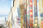 Residents of Tijuana, Baja California, Mexico, decorate the southern side of the barrier at the border with messages of peace and love. (J.D. Long-García)