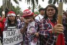 Supporters of Jakarta Governor Basuki "Ahok" Tjahaja Purnama weep as they react to the judges' verdict outside the court where his sentencing hearing is held in Jakarta, Indonesia, on Tuesday, May 9, 2017.  (AP Photo/Dita Alangkara)