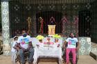 Residents of the quilombola community of Itacoã-Miri, in Pará State, celebrate the festivity of Círio de Santa Maria. The traditional procession was cancelled, so residents stood in front of their homes as a motorcycle circulated with a statue of the Blessed Mother. Photo by Elisa Monteiro.