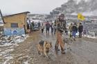 Jasper Spillman, of Lawrence, Kan., joins others departing from the "water protectors" main camp on Feb. 22, 2017, near Cannon Ball, N.D. (Tom Stromme/The Bismarck Tribune via AP)