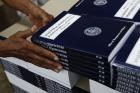 In this photo taken May 19, 2017, a GPO worker stacks copies of "Analytical Perspectives Budget of the U.S. Government Fiscal Year 2018" onto a pallet at the U.S. Government Publishing Office's (GPO) plant in Washington. (AP Photo/Carolyn Kaster)