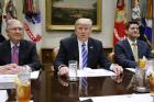 President Donald Trump, flanked by Senate Majority Leader Mitch McConnell of Ky. and House Speaker Paul Ryan of Wis., hosts a meeting with House and Senate leadership, Wednesday, March 1, 2017, in the Roosevelt Room of the White House in Washington. (AP Photo/Evan Vucci)