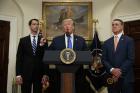 President Donald Trump, flanked by Sen. Tom Cotton, R- Ark., left, and Sen. David Perdue, R-Ga., speaks in the Roosevelt Room of the White House in Washington on Aug. 2, 2017, during the unveiling of legislation that would place new limits on legal immigration. (AP Photo/Evan Vucci)