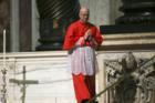 Cardinal Tarcisio Bertone, former Vatican secretary of state, walks during the Good Friday service in St. Peter's Basilica at the Vatican March 25. (CNS photo/Alessandro Bianchi, Reuters)