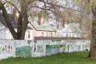 COLOR LINES. This wall, pictured in 2005, was built in the 1940s to enforce residential segregation in Detroit. The wall still stands, even though neighborhoods on both sides are now uniformly African-American.