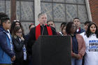 Cardinal Blase Cupich and young members of Immaculate Conception Catholic Church in Chicago spoke out against gun violence during a Good Friday peace walk on March 30. (Photo: Archdiocese of Chicago.)