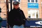 A Familiar Pose. Father Berrigan speaks in October 2006 at the 3rd Annual Staten Island Freedom & Peace Festival. Photo by Clara Sherley-Appel; Wikicommons