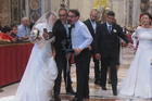 Members of the wedding party pose for selfies before Mass begins. 