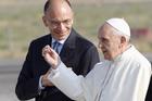 Pope Francis talks with Italy’s Prime Minister Enrico Letta before boarding a plane at Fiumicino airport in Rome in July 2013 to join more than 300,000 young people for World Youth Day in Brazil. (CNS photo/Giampiero Spo sito, Reuters