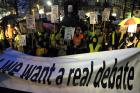 Protesters in Brussels hold banners on Feb. 11 against legislation authorizing euthanasia for children.