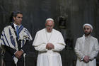 Pope Francis stands between Jewish and Muslim religious leaders during a prayer service at the ground zero 9/11 Memorial Museum in New York, Sept. 25 (CNS Photo / Paul Haring)..