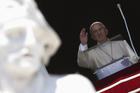 Pope waves as he leads Angelus at Vatican (CNS photo/Alessandro Bianchi, Reuters).
