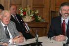 Democratic Unionist Party leader Ian Paisley, left, and Sinn Fein leader Gerry Adams, right, address a news conference after the main Protestant and Catholic parties agreed to start sharing power, May 8, 2007.