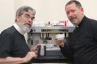 Brother Guy Consolmagno, S.J., and Father Paul Mueller, S.J. at the Vatican Observatory coffee machine. (photo provided)